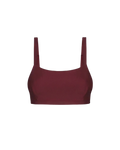 Bordeaux red crop top with thin straps and smooth ribbed texture, front view on white background