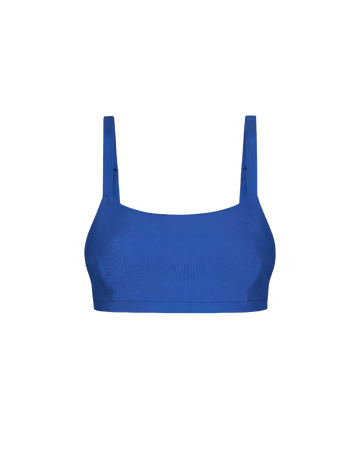 Royal blue cropped top with textured fabric and wide shoulder straps, front view, minimalist design