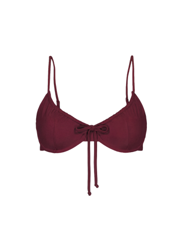 Bordeaux red drawstring top with thin straps and front bow, front view, smooth fabric, minimalist design